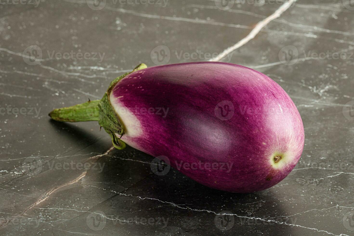 Raw purple ripe eggplant for cooking photo