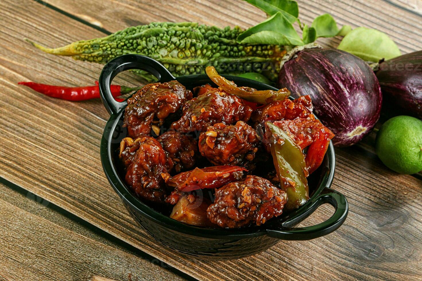 Asian cuisine - pork with chili sauce photo