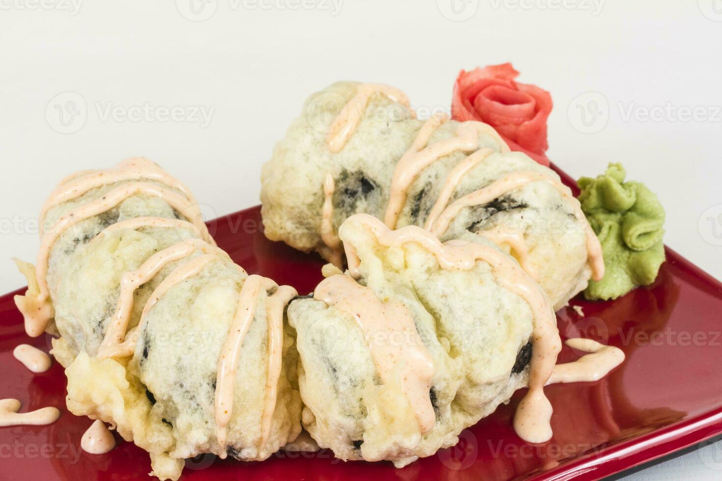 Tempura Maki Sushi Deep Fried Roll made of salmon, tobiko roe and Cream Cheese inside photo