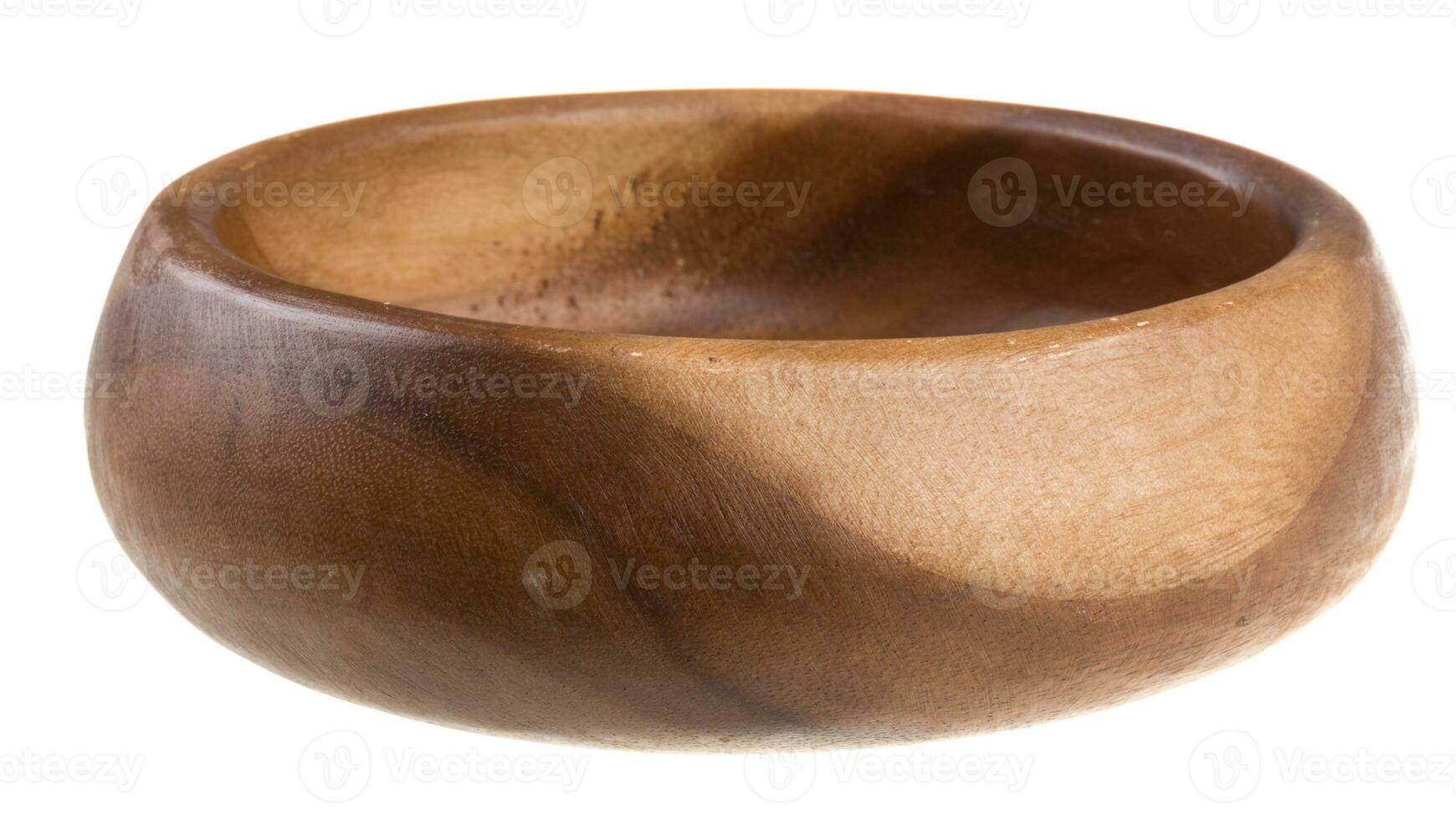 Wooden bowl isolated on white photo