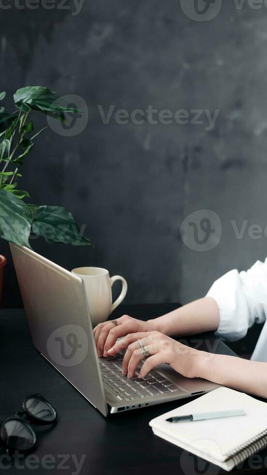 Close-Up of Woman's Hands Typing on Laptop. Online Learning, Internet Marketing, Work from Home, Freelance, Office Workplace Concept photo