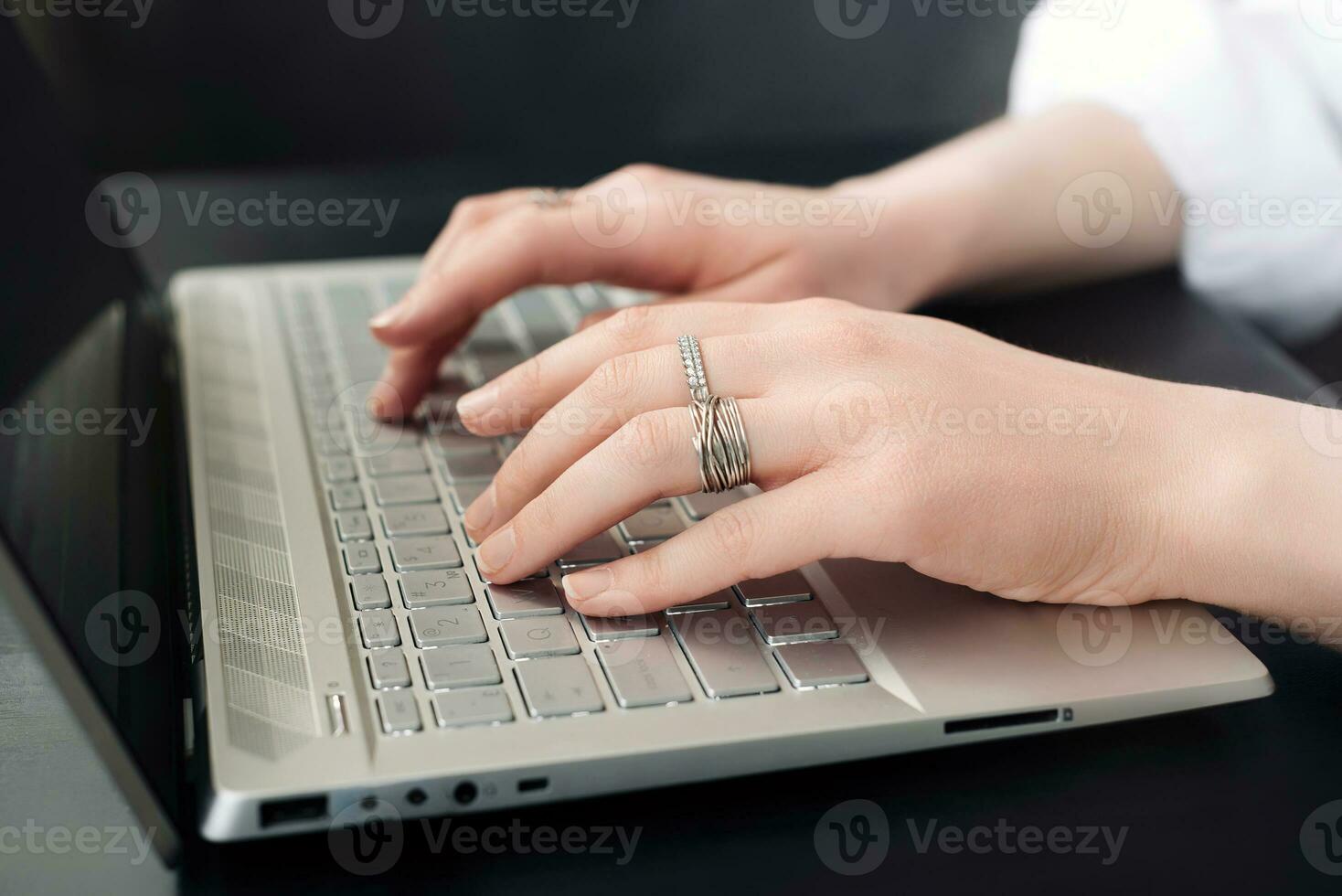 Business Woman's Workspace. Female Hands on Laptop Keyboard. Close-Up. Female Hands Typing on Computer Keyboard for Online Learning photo