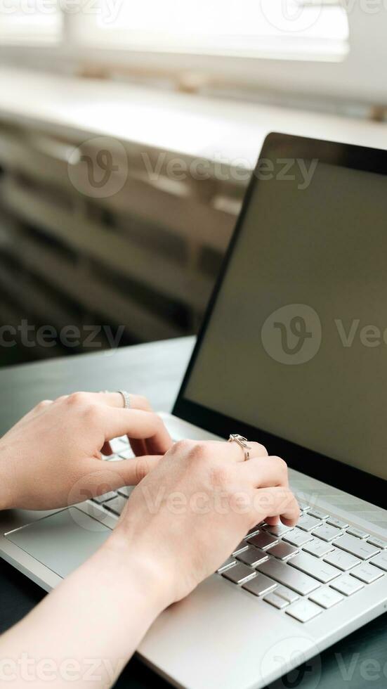 Productive Workspace. Woman's Hands Typing on Laptop Keyboard, Balancing Work and Learning at Office, Embracing Online Learning, Internet Marketing, Freelancing, and Work from Home Concept photo