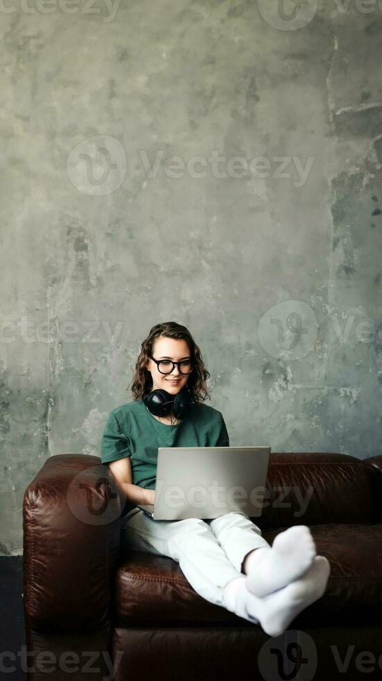 Productive Home Office. Young Woman Engaged in Laptop Work, Representing Work-from-Home, Freelancing, Business, and Lifestyle Concept for Students and Professionals. photo