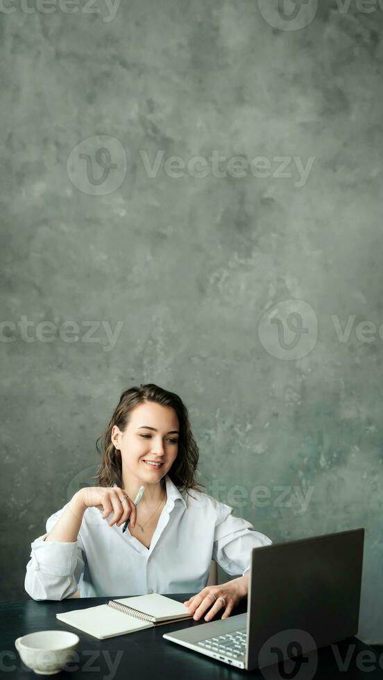 Digital Teaching. Elegant Businesswoman or Teacher Engaging in Video Conference from Office - Emphasizing Online Work and Remote Education Concepts photo