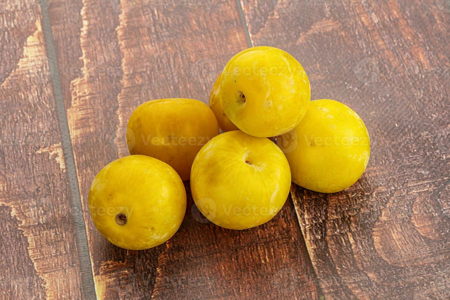 Yellow sweet plum heap fruit photo