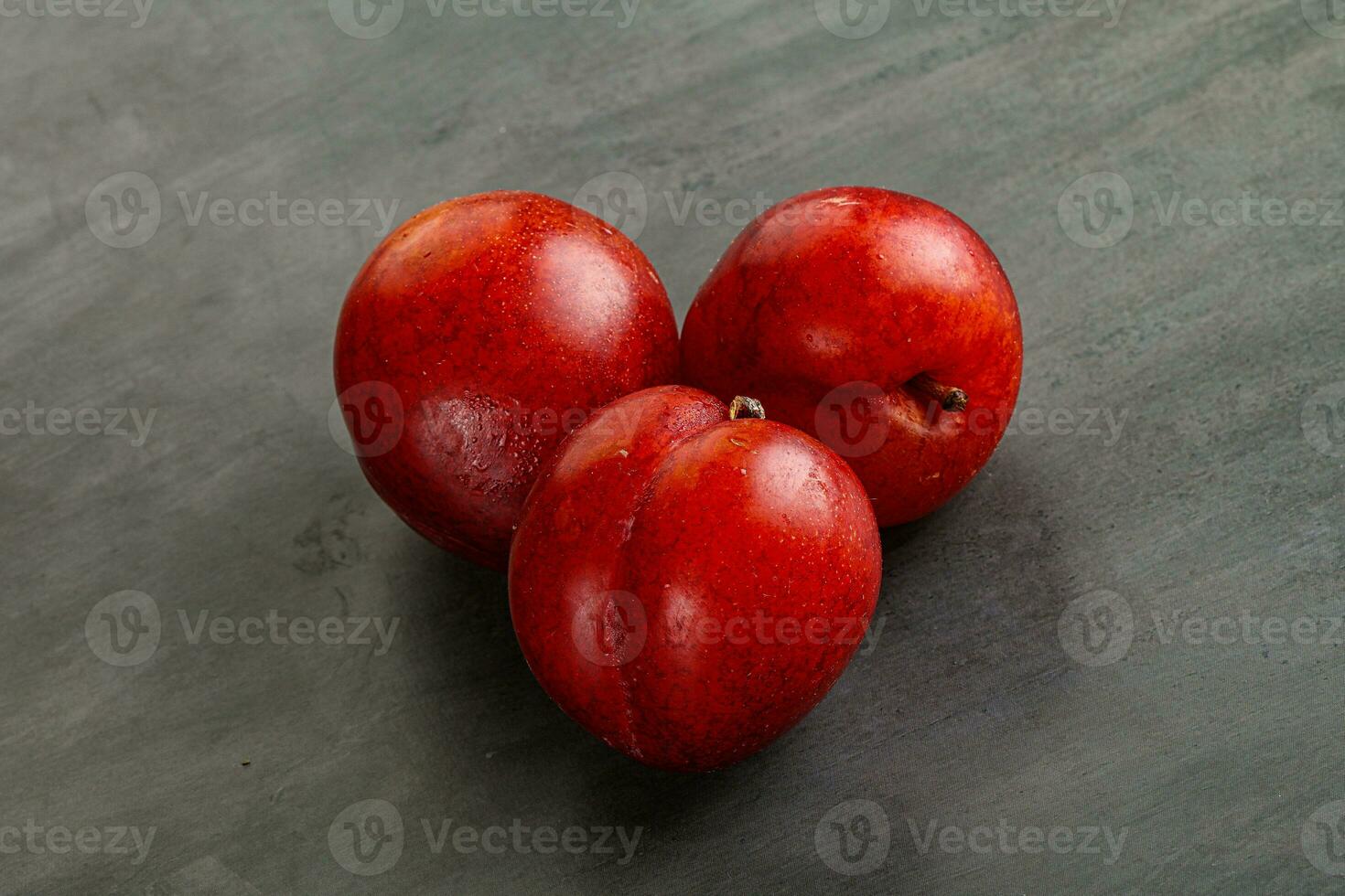 Ripe sweet juicy red plum photo