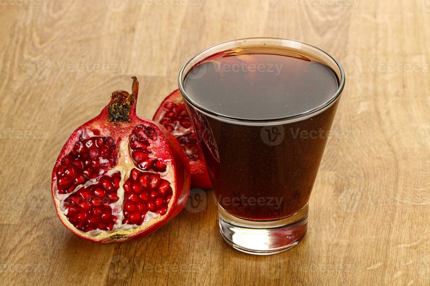 Sweet pomegranate juice in glass photo