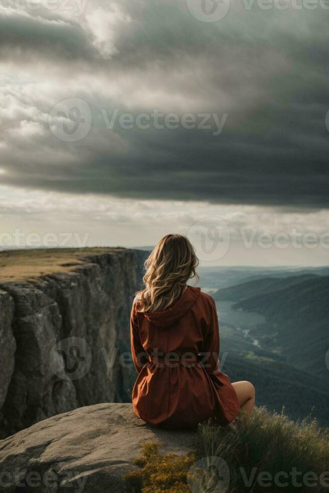 Back view of a woman sitting alone at the big mountains. AI Generative photo