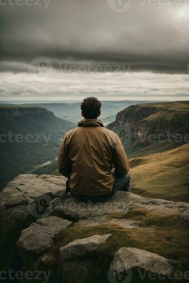 Back view of a man sitting alone at the big mountains. AI Generative photo