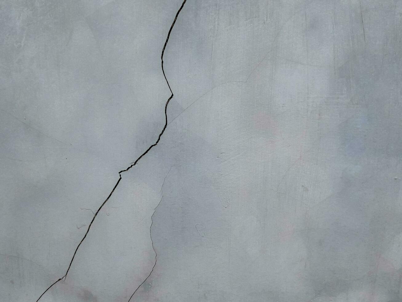 Concrete wall textured of rough and cracked. Grunge background with copy space photo