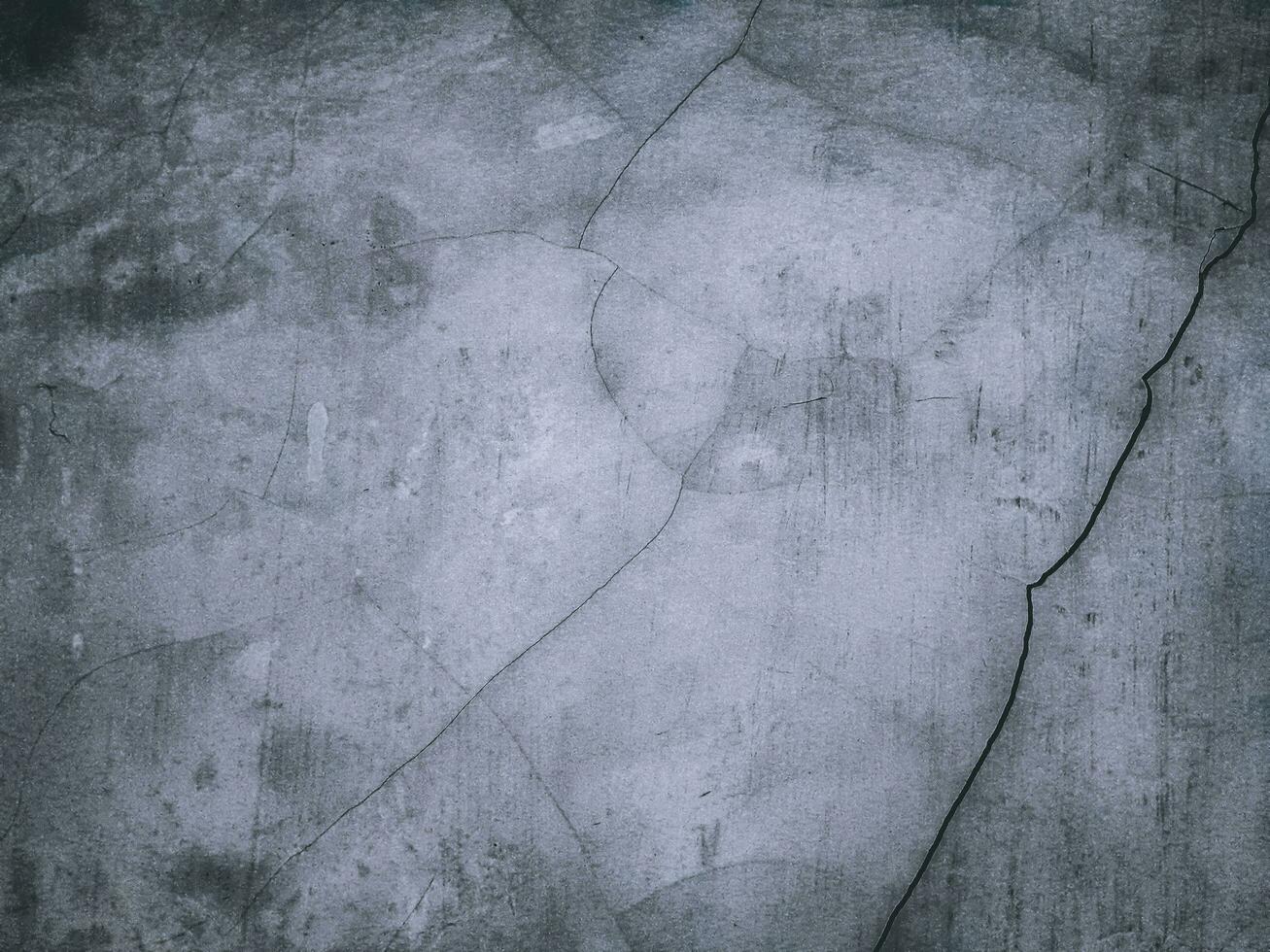 Concrete wall textured of rough and cracked. Grunge background with copy space photo