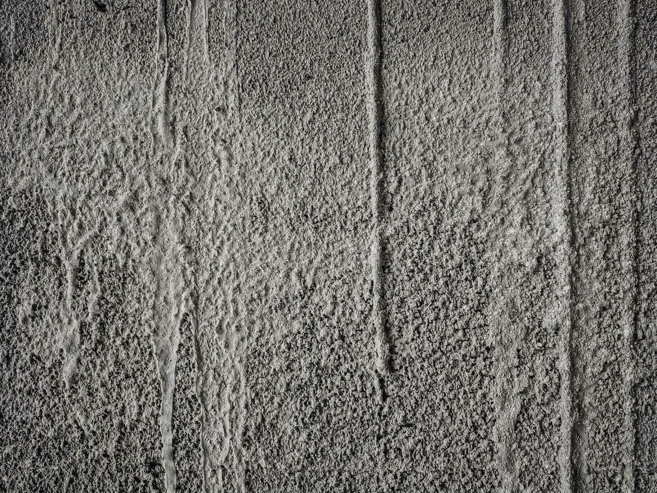 Grainy textured concrete wall for pattern and background photo
