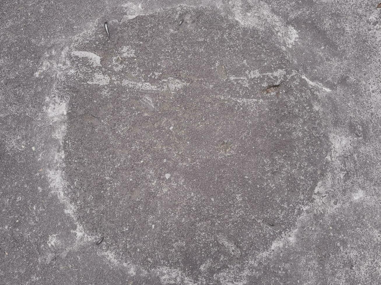 Grungy wall of gray concrete texture with cracked surface from sand and cement materials. photo