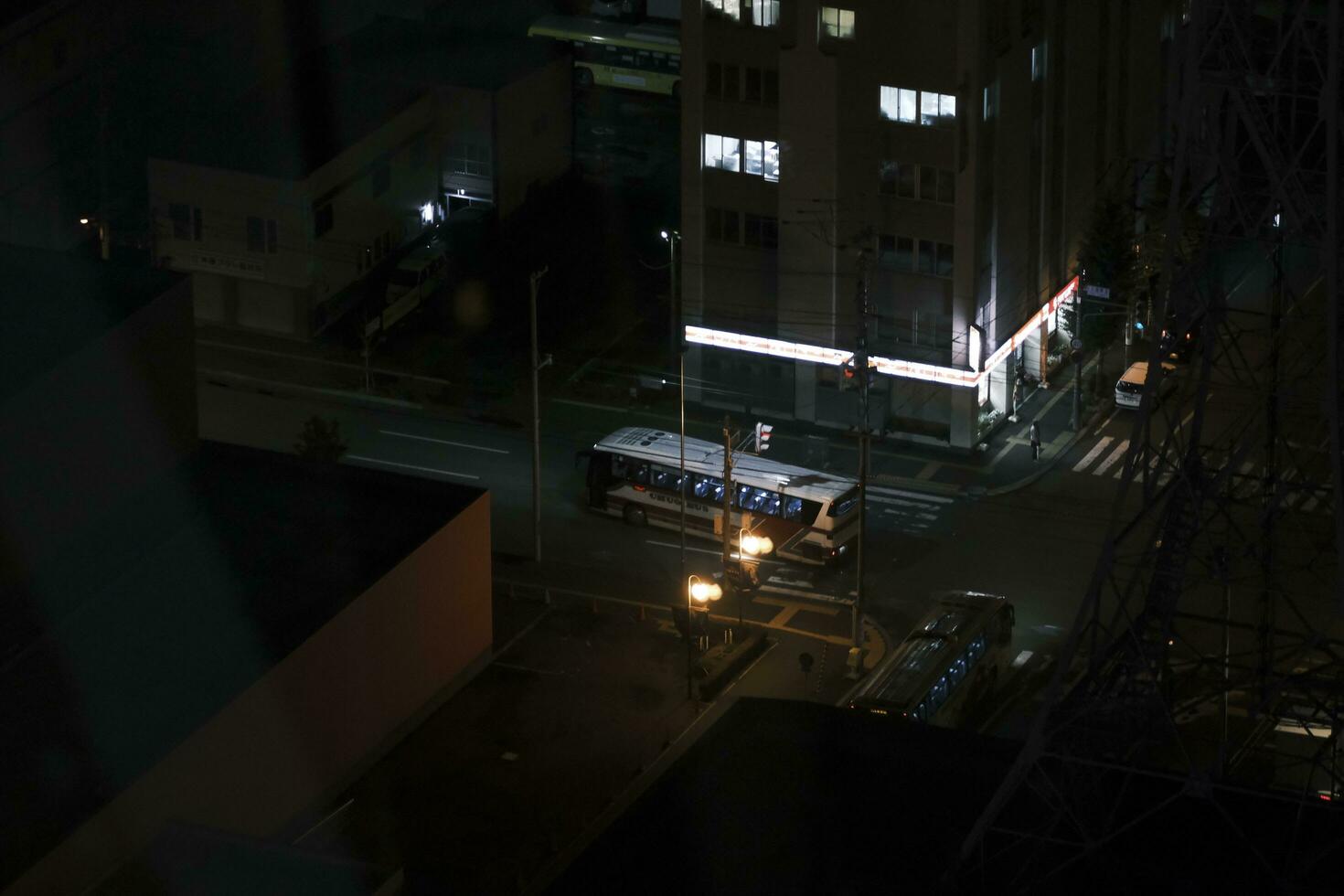 car and bus in traffic in the night photo