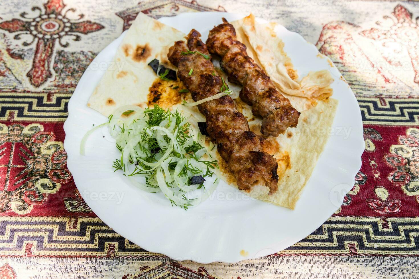 portion of Armenian kebabs on plate photo