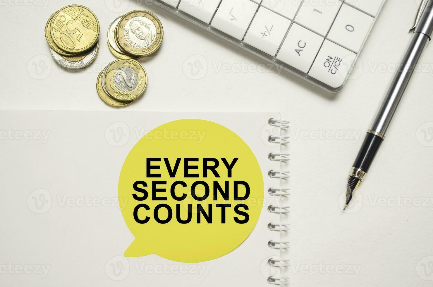 EVERY SECOND COUNTS on yellow sticker on pen with coin photo