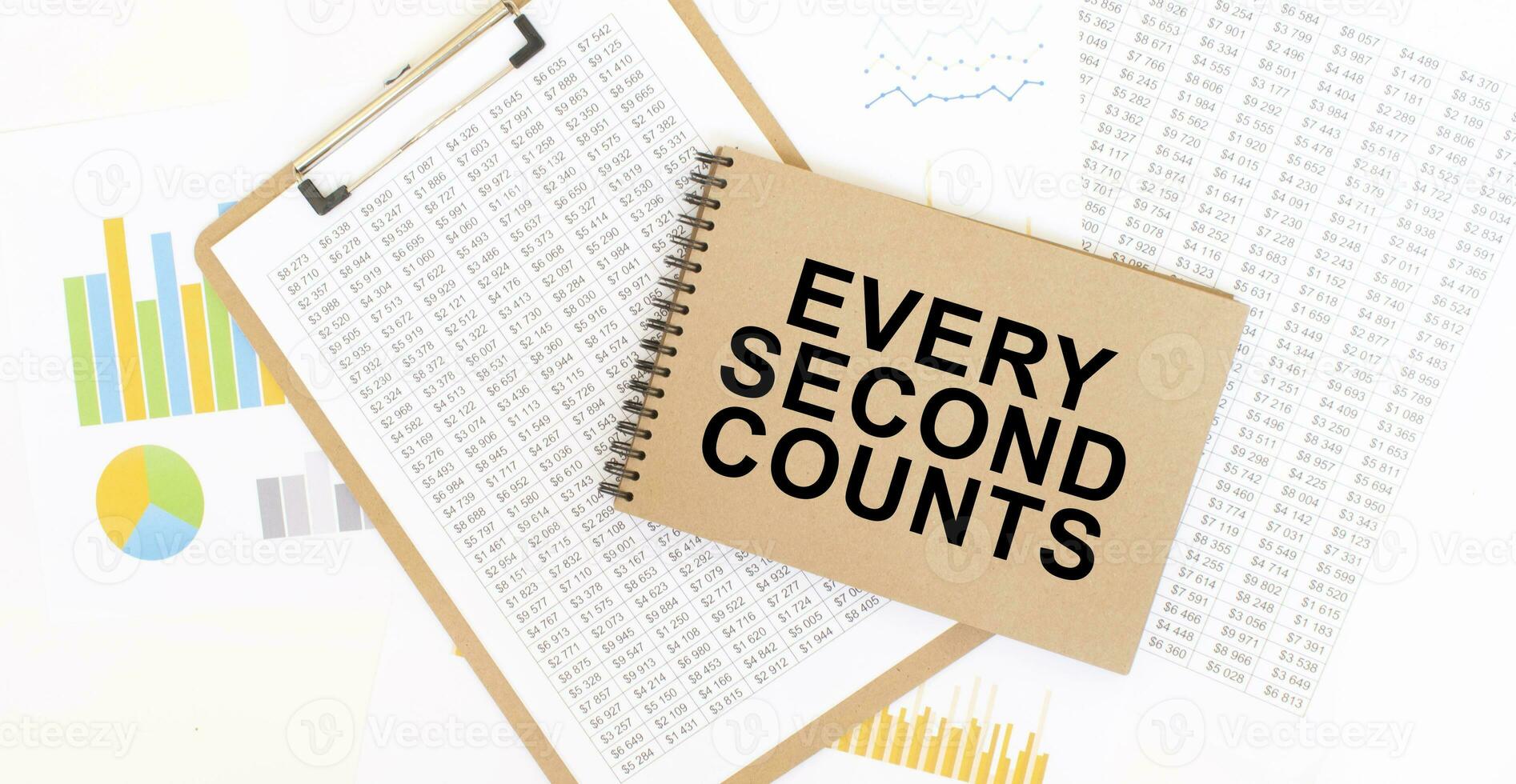 Text EVERY SECOND COUNTS on brown paper notepad on the table with diagram. Business concept photo