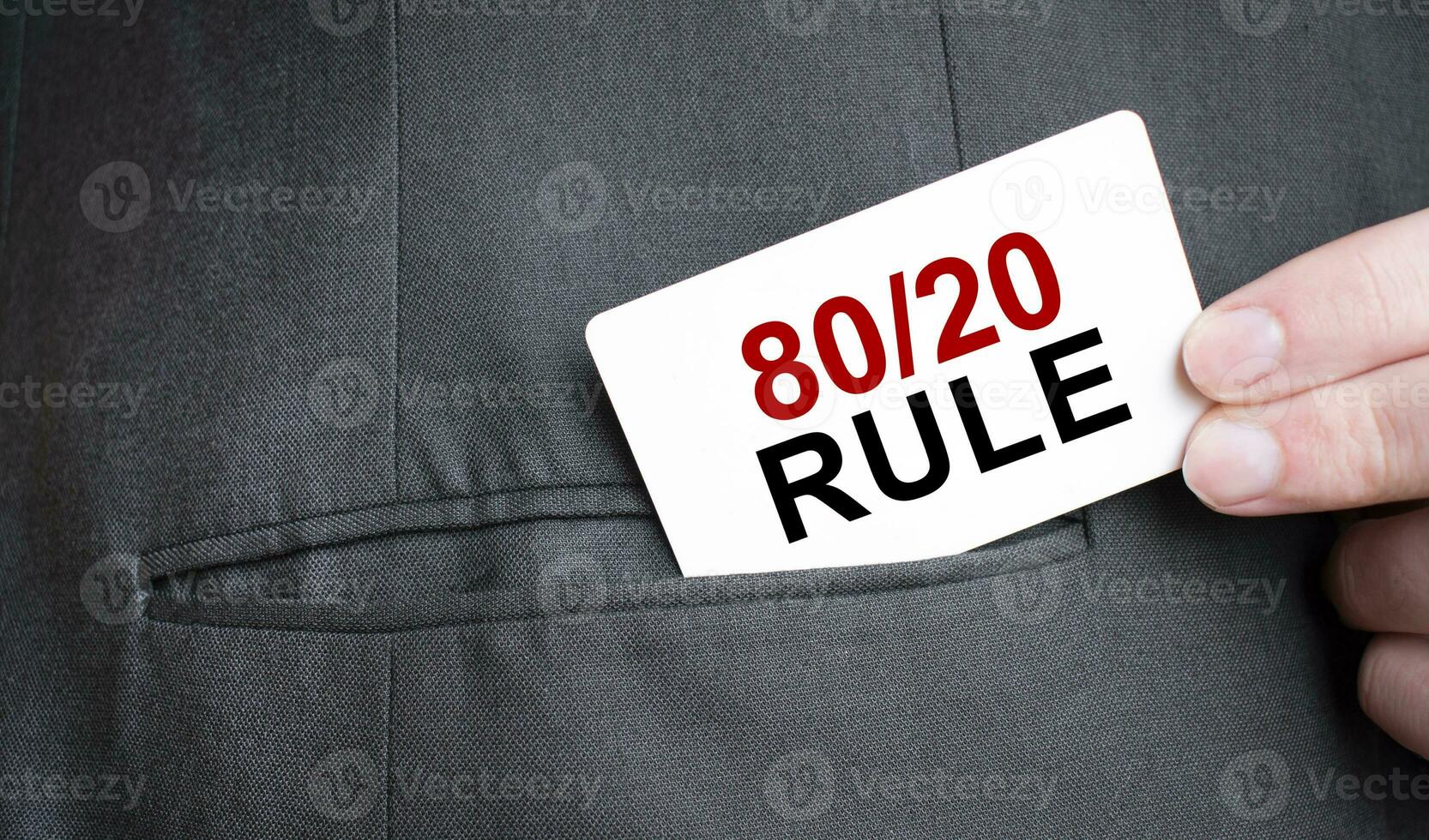 Card with 80 and 20 rule text in pocket of businessman suit. Investment and decisions business concept. photo