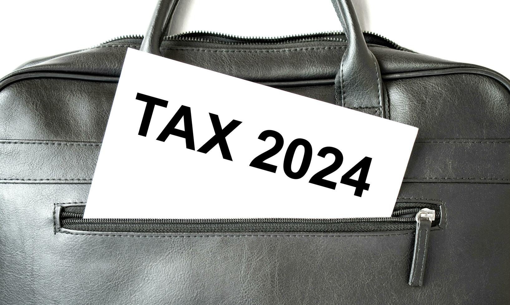 tax 2024 paper sheet and black bag photo