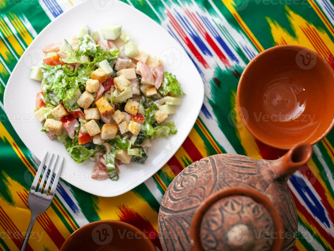 Tomato, cucumber, sweet pepper and onion salad, seasoned with oil. Asian style photo