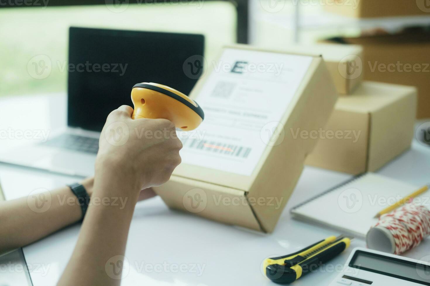 Scanning parcel barcode before shipment. photo