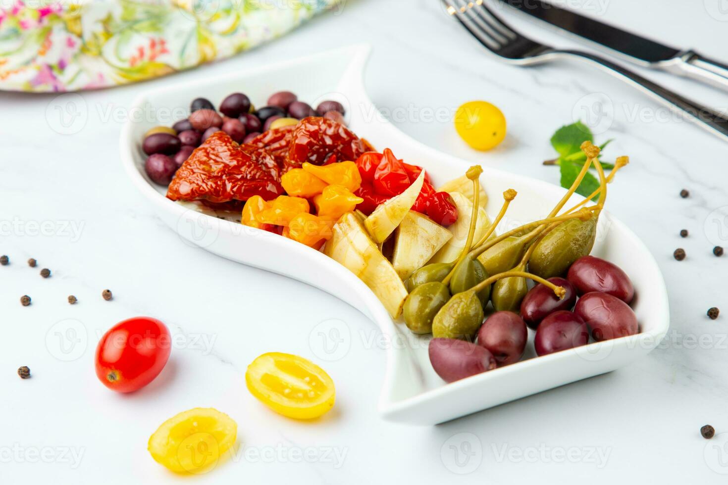 assorted nuts and dried vegetables on a light background side view photo