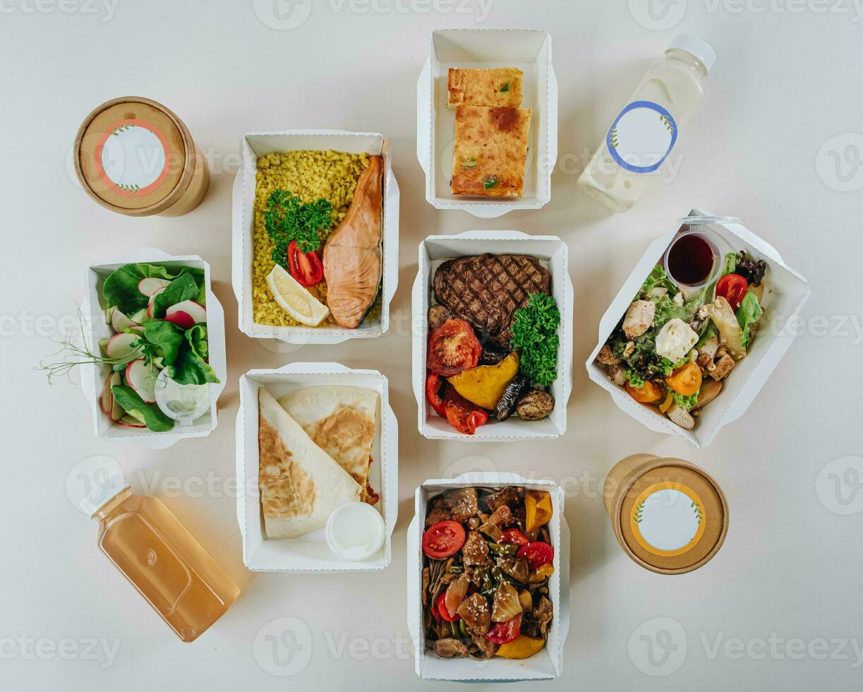 food in containers. proper nutrition, daily diet, weight loss. soup, drink, salad, steak. Top view photo