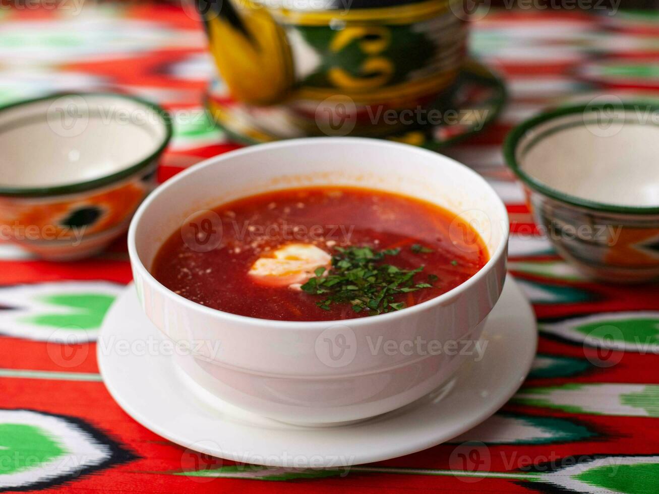 Borscht. Russian soup made from meat, beets, potatoes and served with sour cream. Asian style photo