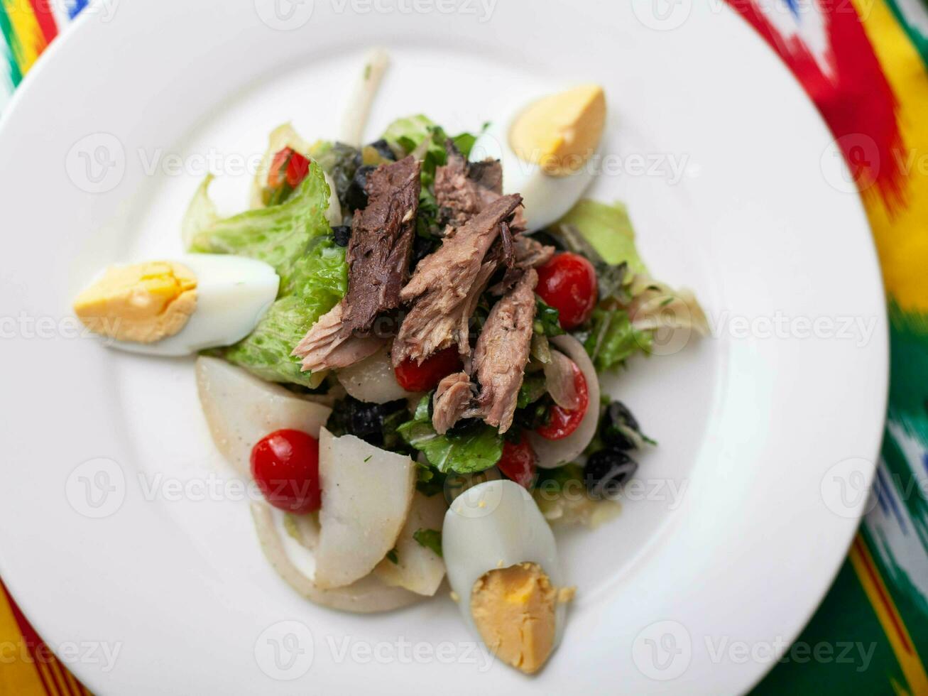 Salad with tuna. Salad with eggs, herbs, onions, cherry tomatoes, and tuna. Asian style photo