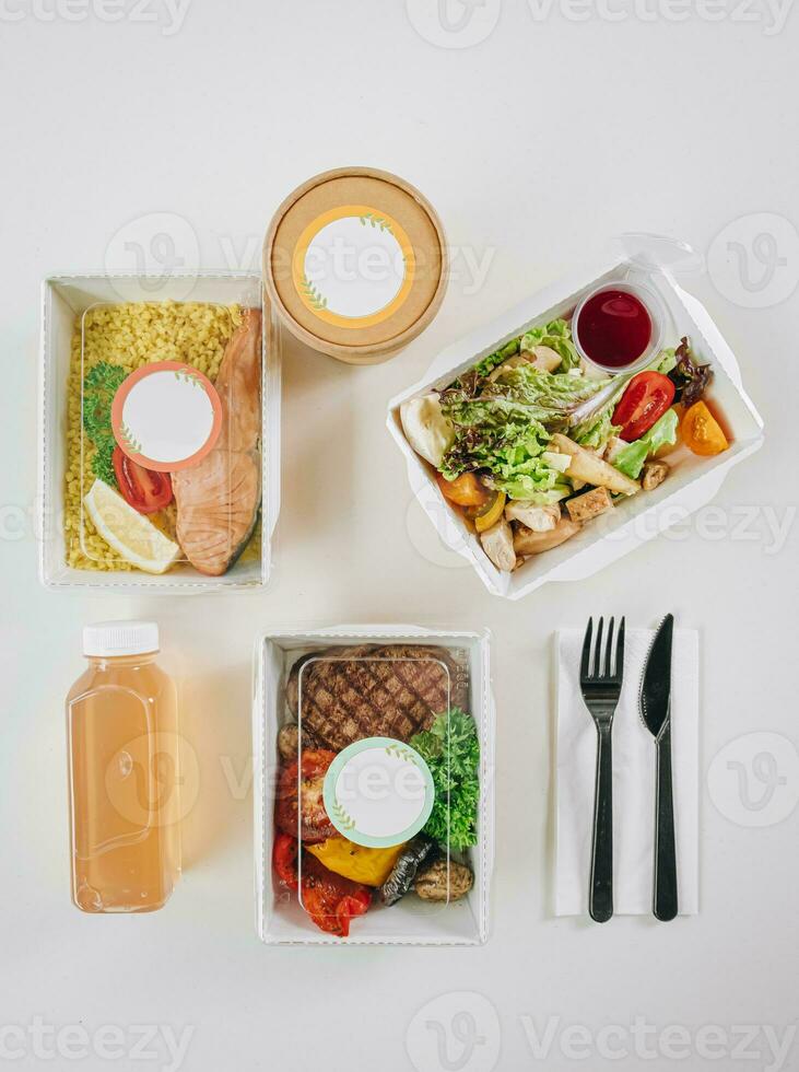 food in containers. proper nutrition, daily diet, weight loss. soup, drink, salad, steak. Top view photo