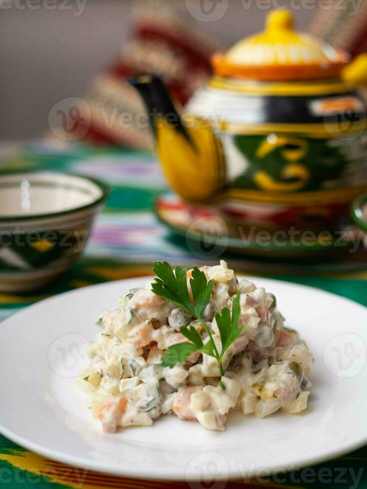 Olivier salad according to the Russian recipe. Asian style photo