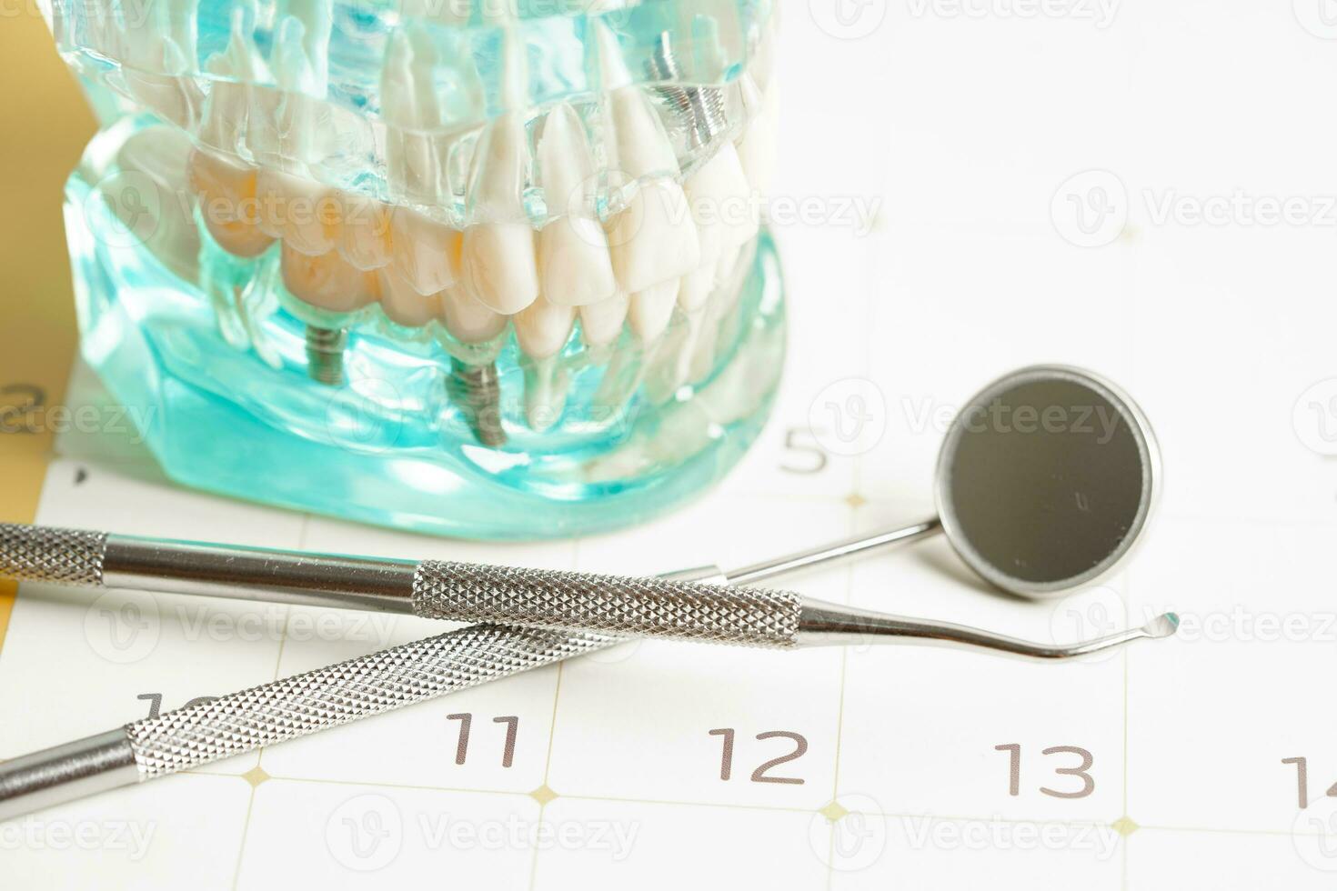 Dental appointment reminder in calendar, healthy teeth, dental health care. photo