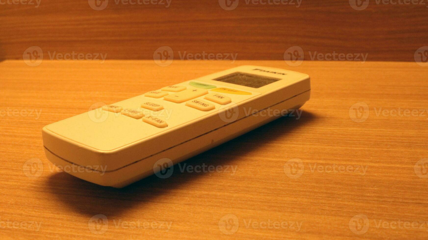 Close up of the air conditioner remote on the table photo