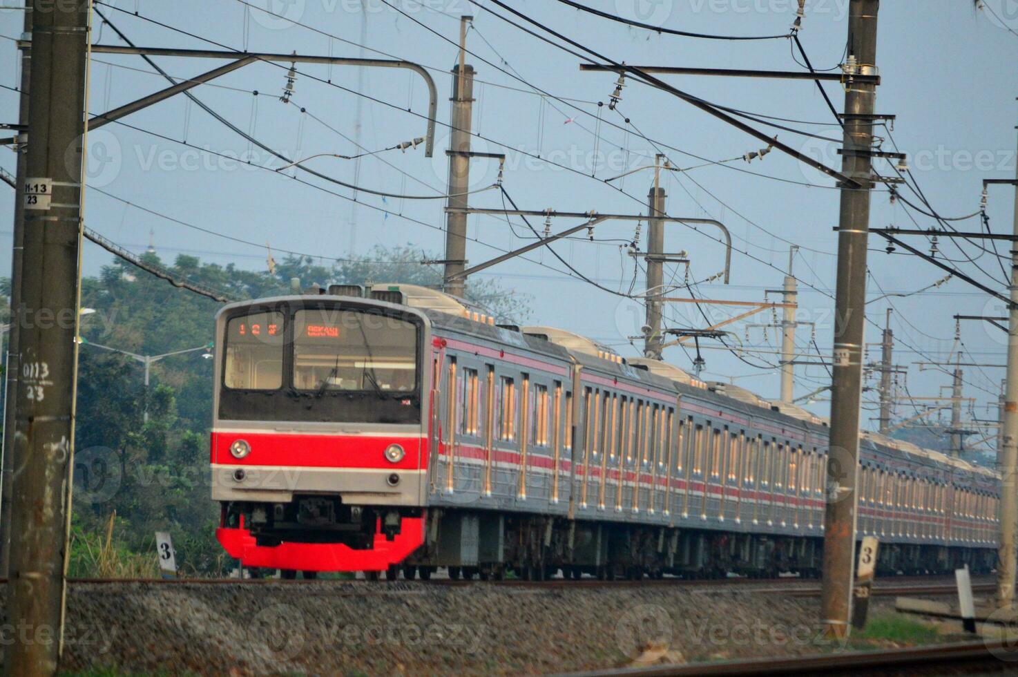 The train is running on the rails towards the destination photo