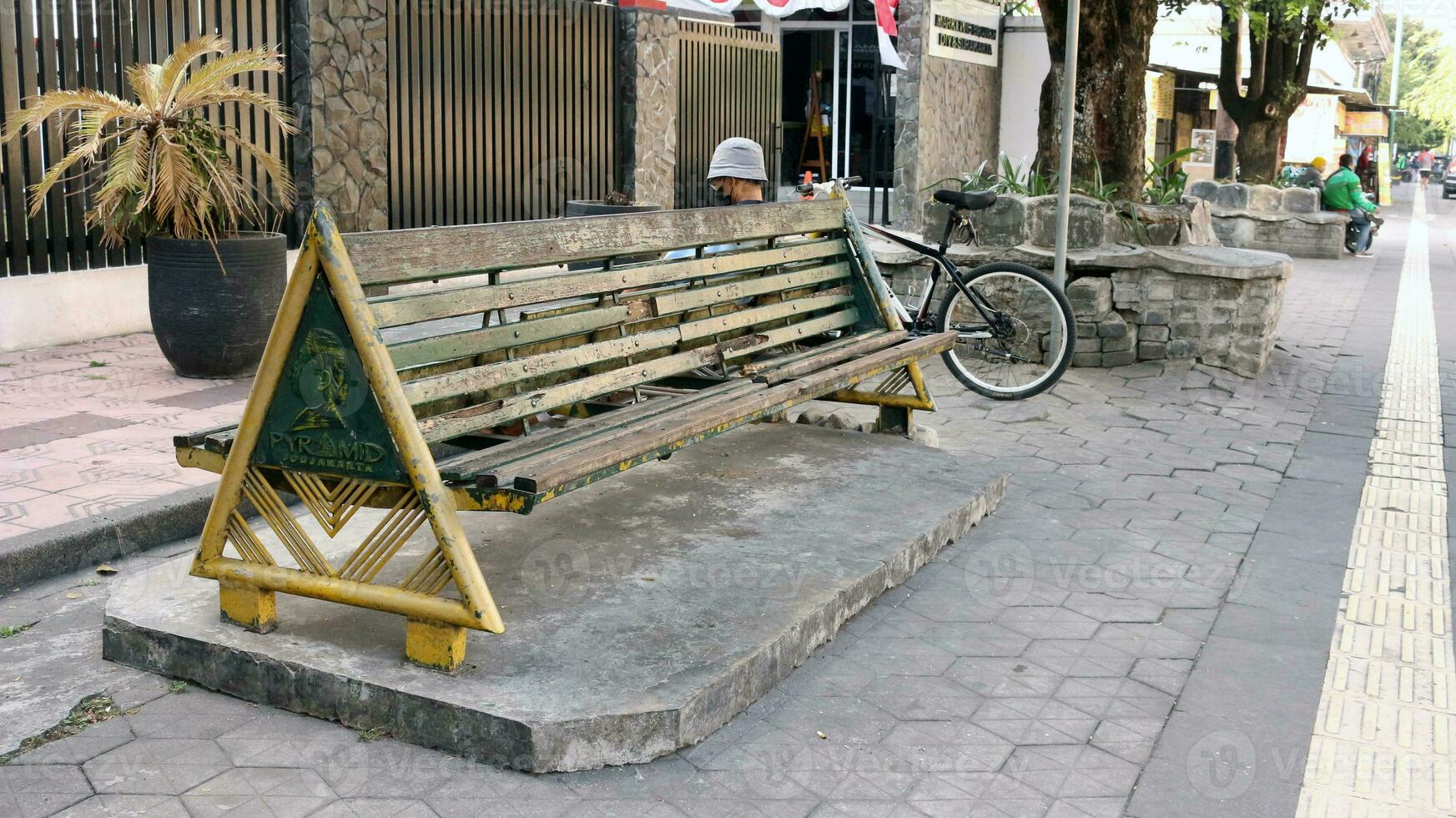 Bench on the side of the street in Jogjakarta photo