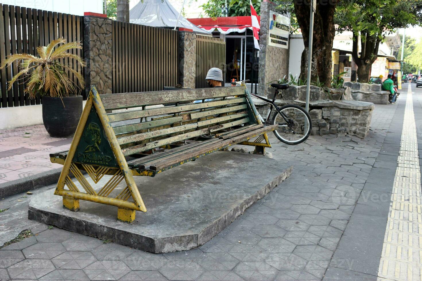 Bench on the side of the street in Jogjakarta photo