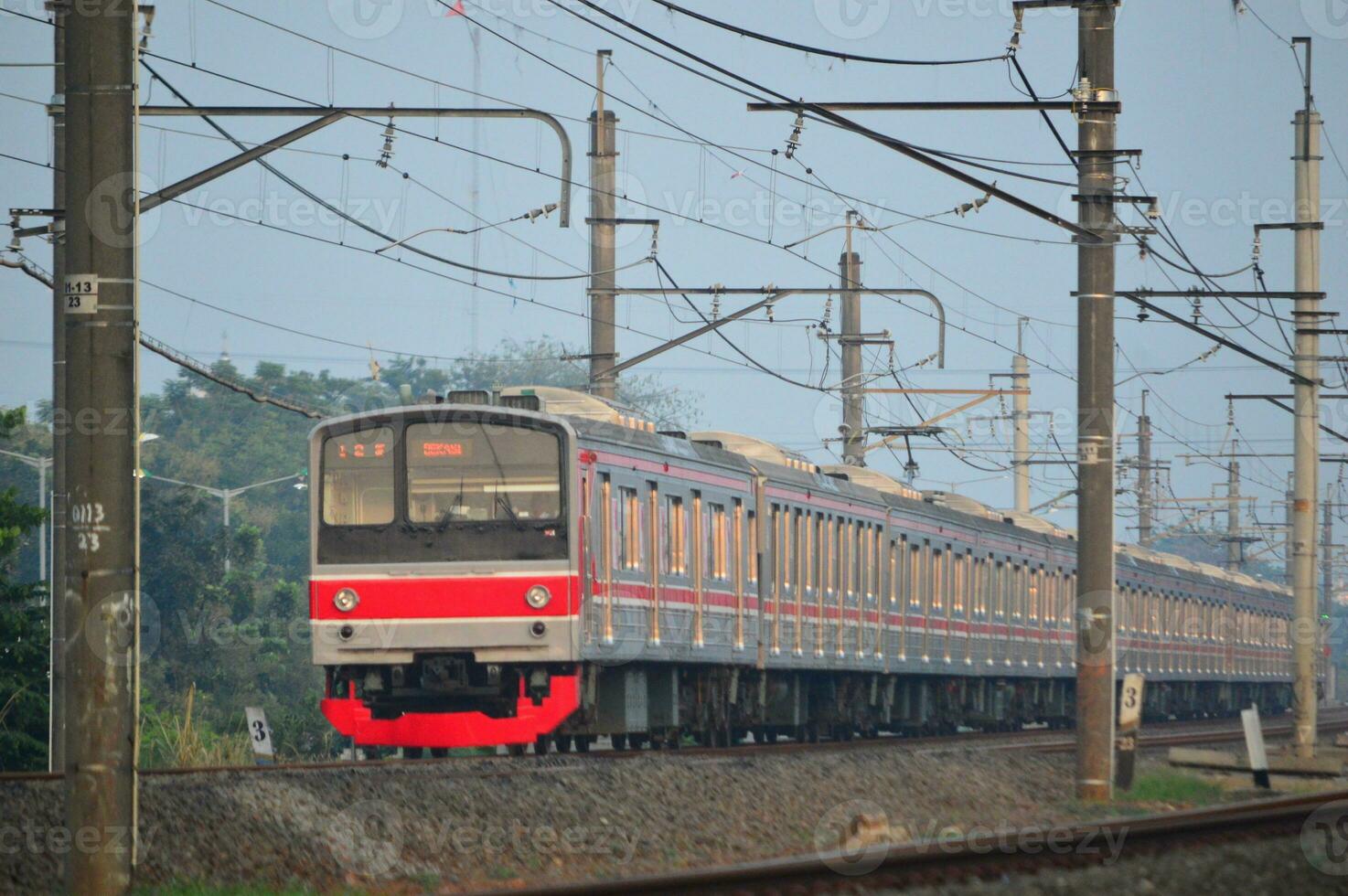 The train is running on the rails towards the destination photo