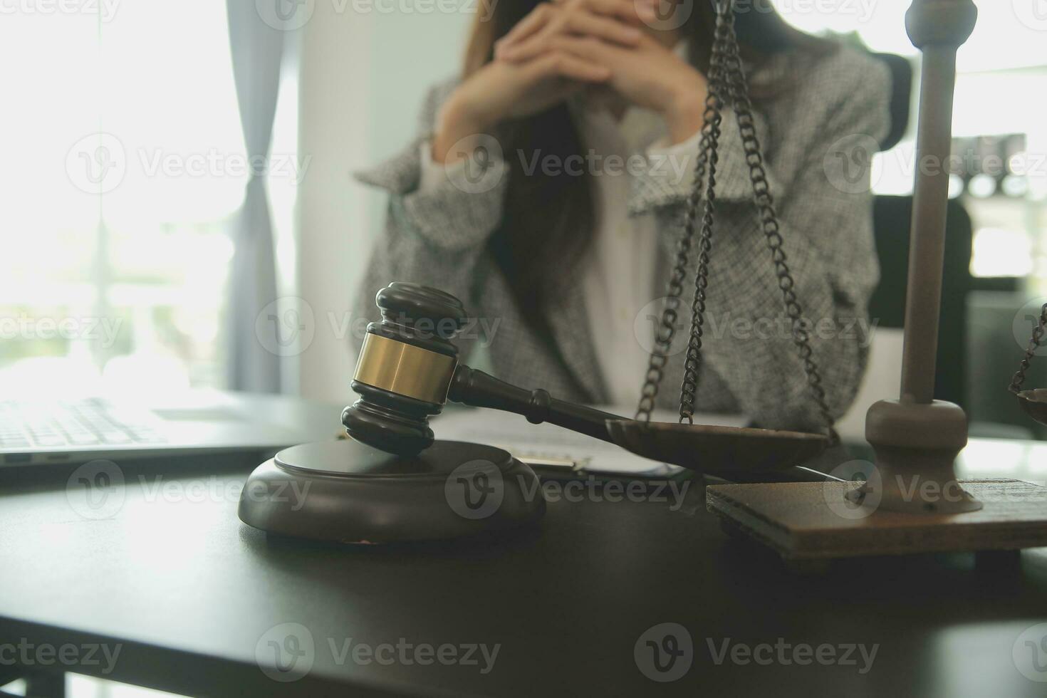 Business and lawyers discussing contract papers with brass scale on desk in office. Law, legal services, advice, justice and law concept picture with film grain effect photo