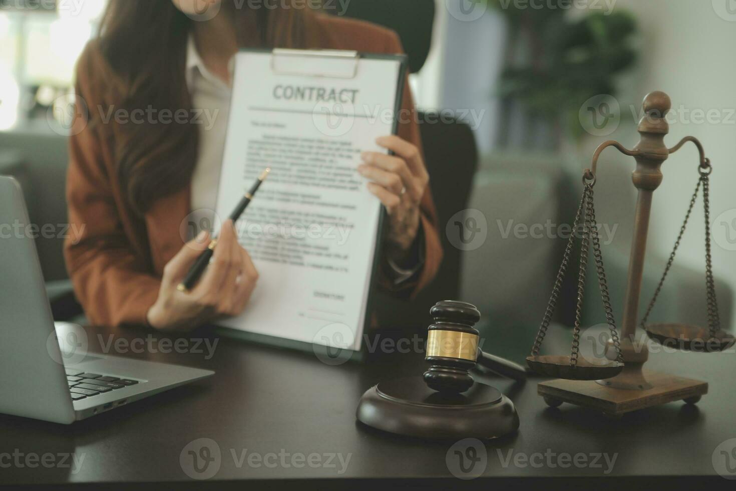 Business and lawyers discussing contract papers with brass scale on desk in office. Law, legal services, advice, justice and law concept picture with film grain effect photo
