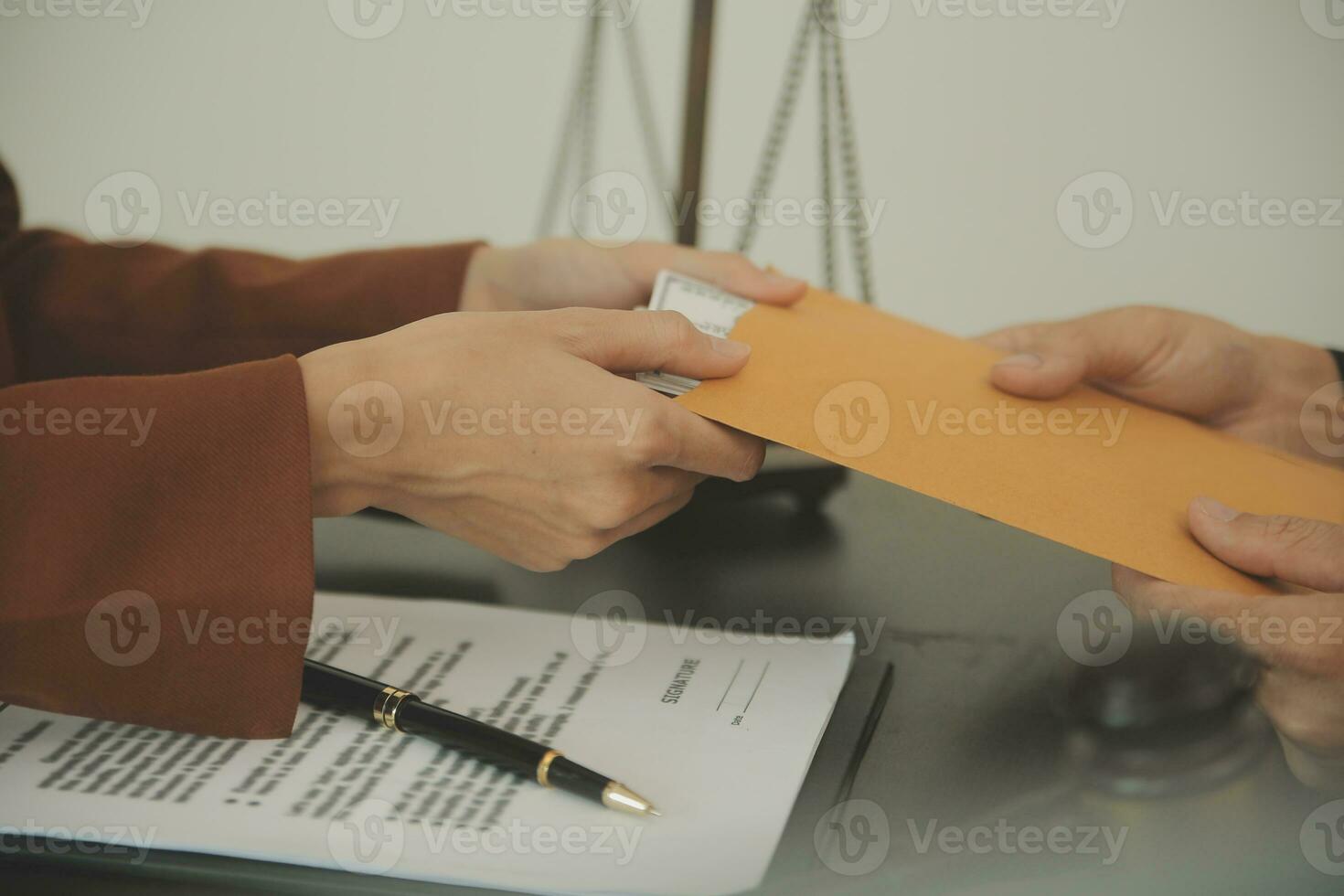 Business and lawyers discussing contract papers with brass scale on desk in office. Law, legal services, advice, justice and law concept picture with film grain effect photo