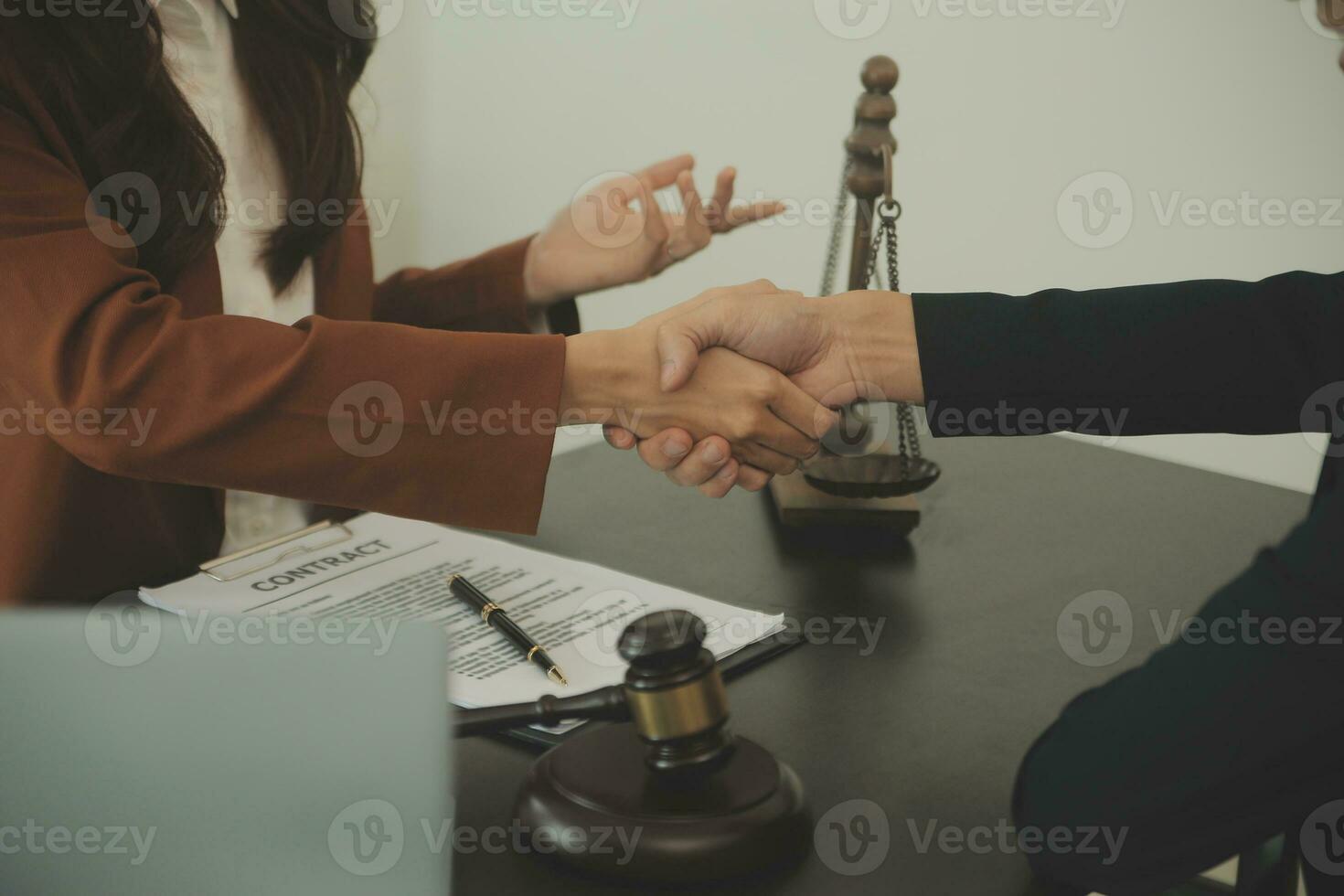 Business and lawyers discussing contract papers with brass scale on desk in office. Law, legal services, advice, justice and law concept picture with film grain effect photo