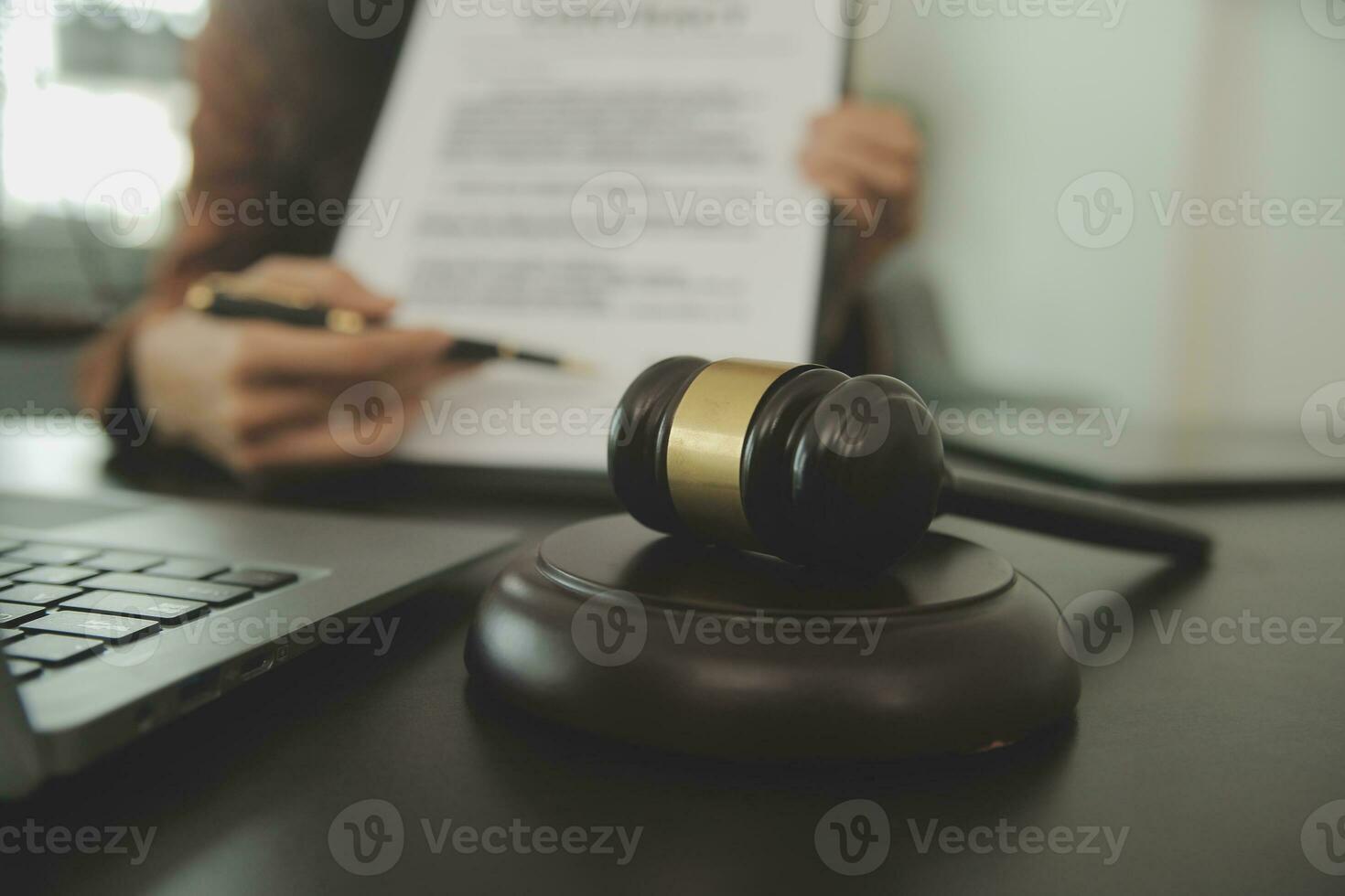 Business and lawyers discussing contract papers with brass scale on desk in office. Law, legal services, advice, justice and law concept picture with film grain effect photo