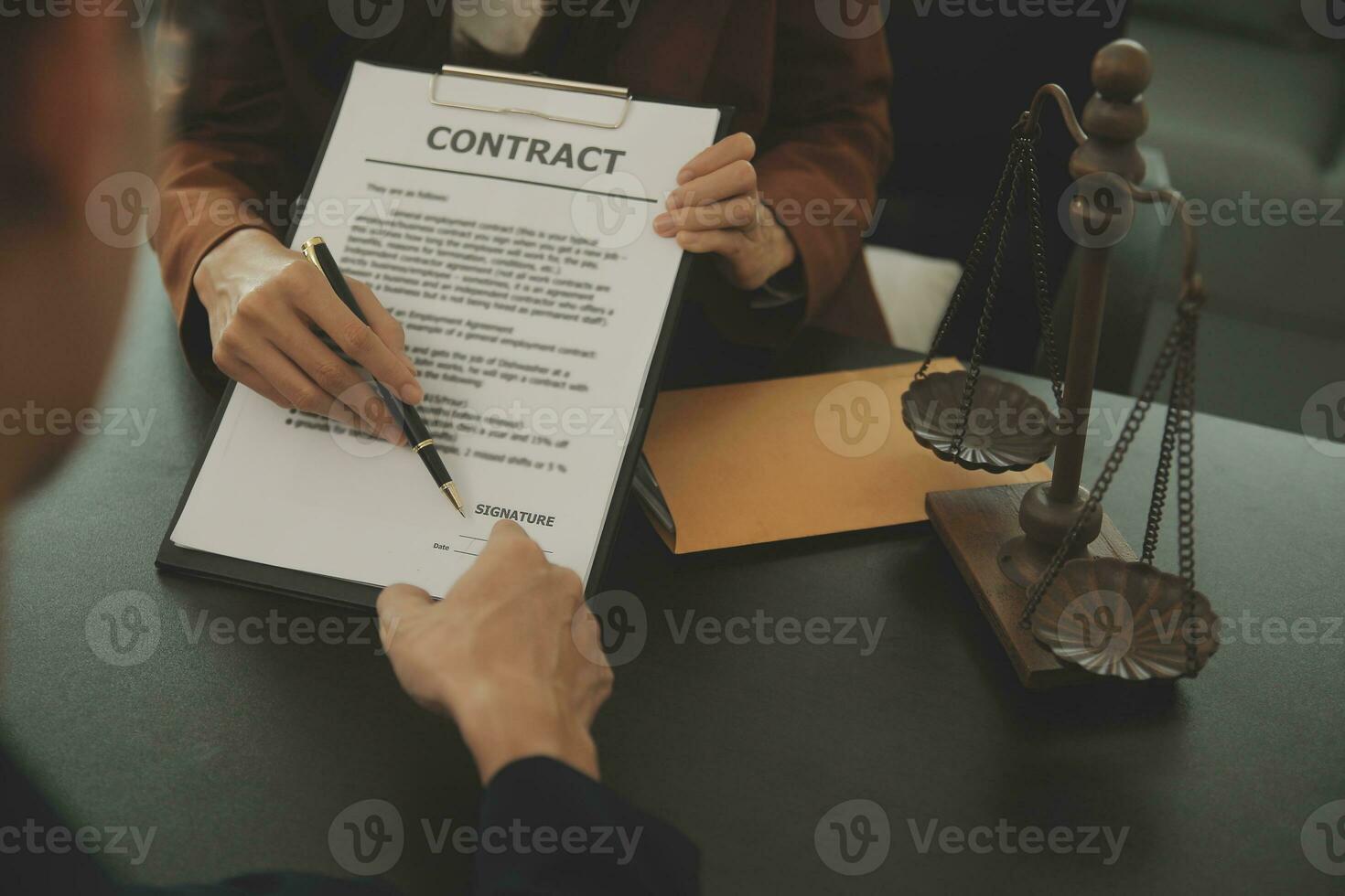 Business and lawyers discussing contract papers with brass scale on desk in office. Law, legal services, advice, justice and law concept picture with film grain effect photo