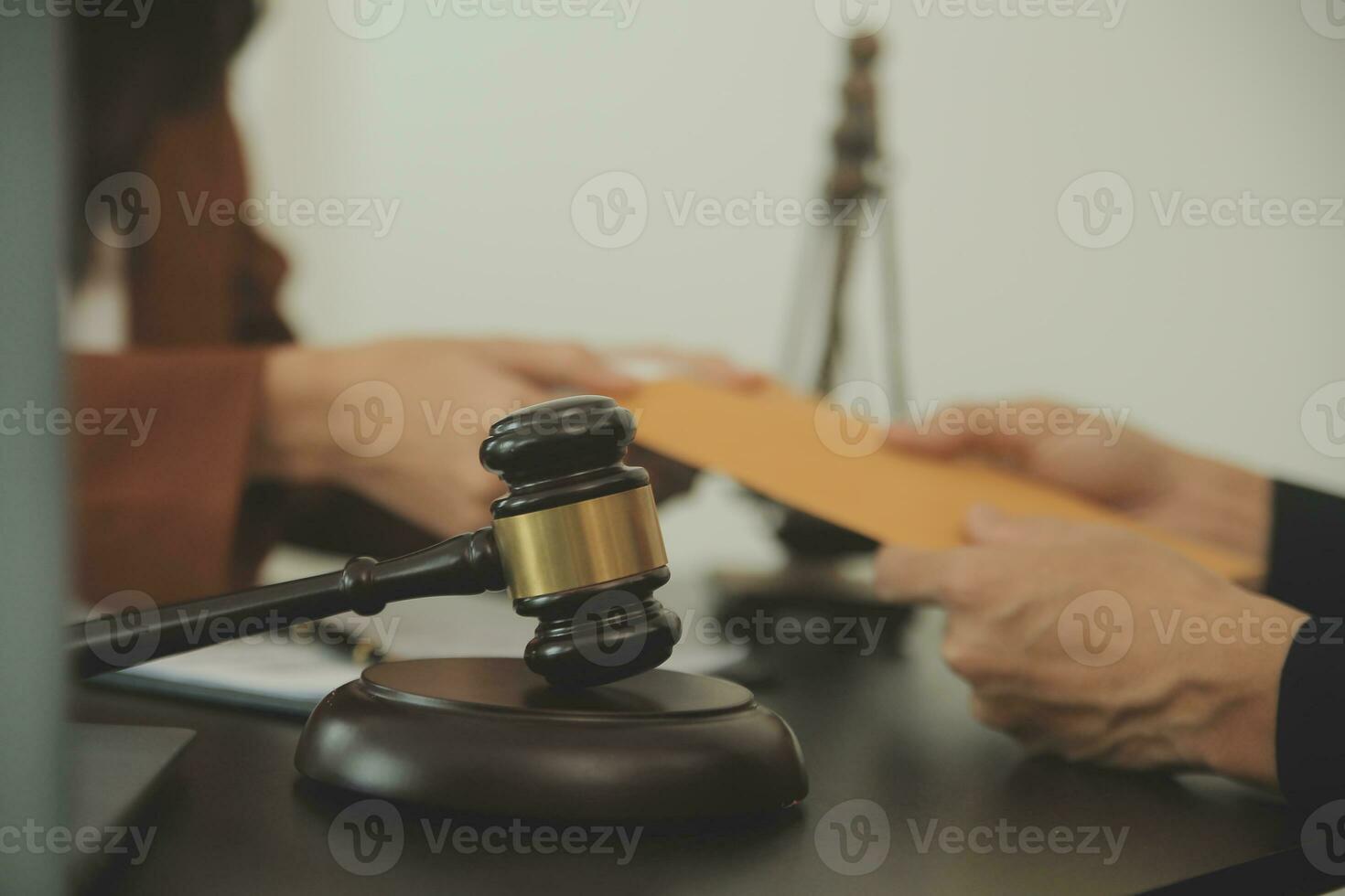 Business and lawyers discussing contract papers with brass scale on desk in office. Law, legal services, advice, justice and law concept picture with film grain effect photo