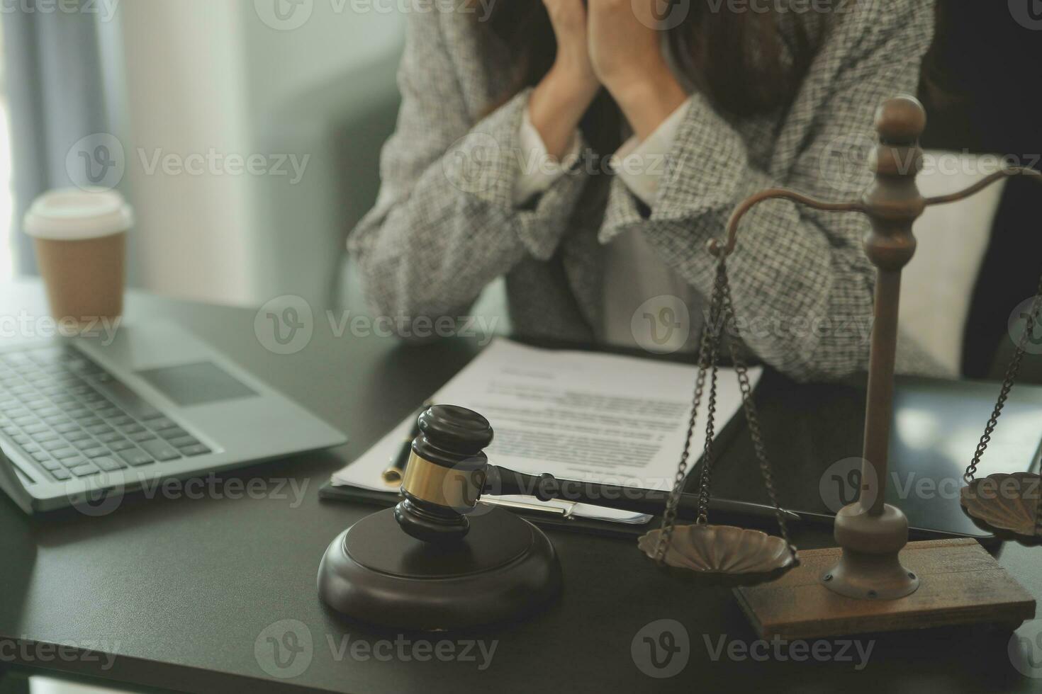 Business and lawyers discussing contract papers with brass scale on desk in office. Law, legal services, advice, justice and law concept picture with film grain effect photo