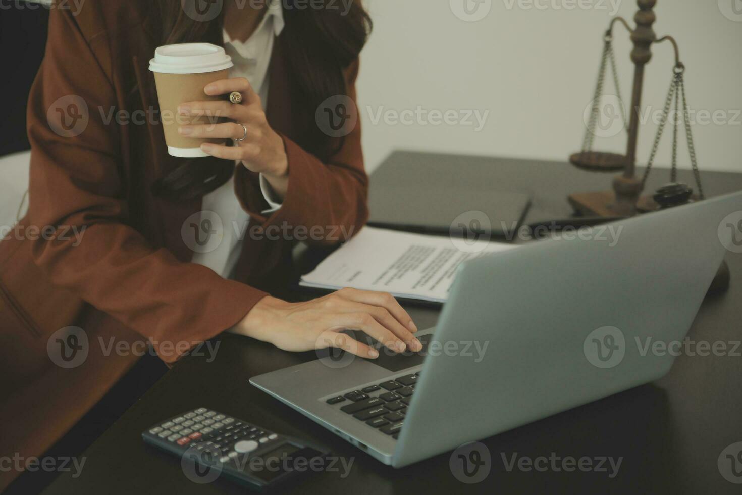 Business and lawyers discussing contract papers with brass scale on desk in office. Law, legal services, advice, justice and law concept picture with film grain effect photo