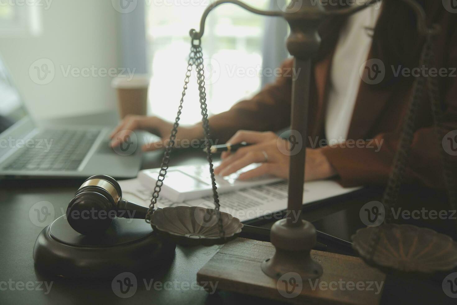 Business and lawyers discussing contract papers with brass scale on desk in office. Law, legal services, advice, justice and law concept picture with film grain effect photo