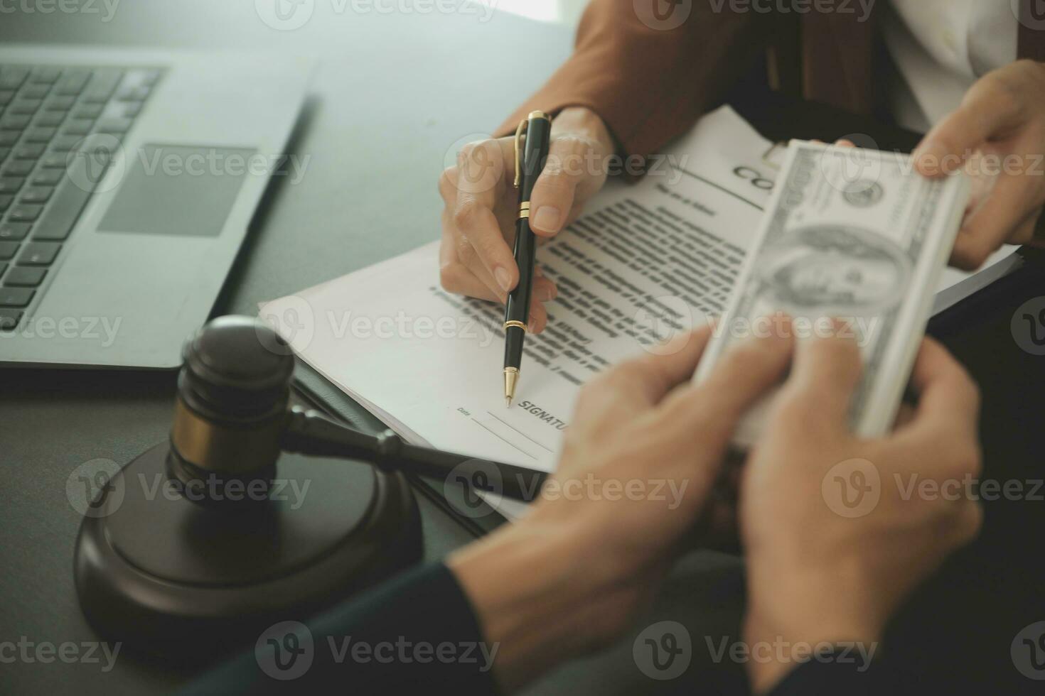 Business and lawyers discussing contract papers with brass scale on desk in office. Law, legal services, advice, justice and law concept picture with film grain effect photo