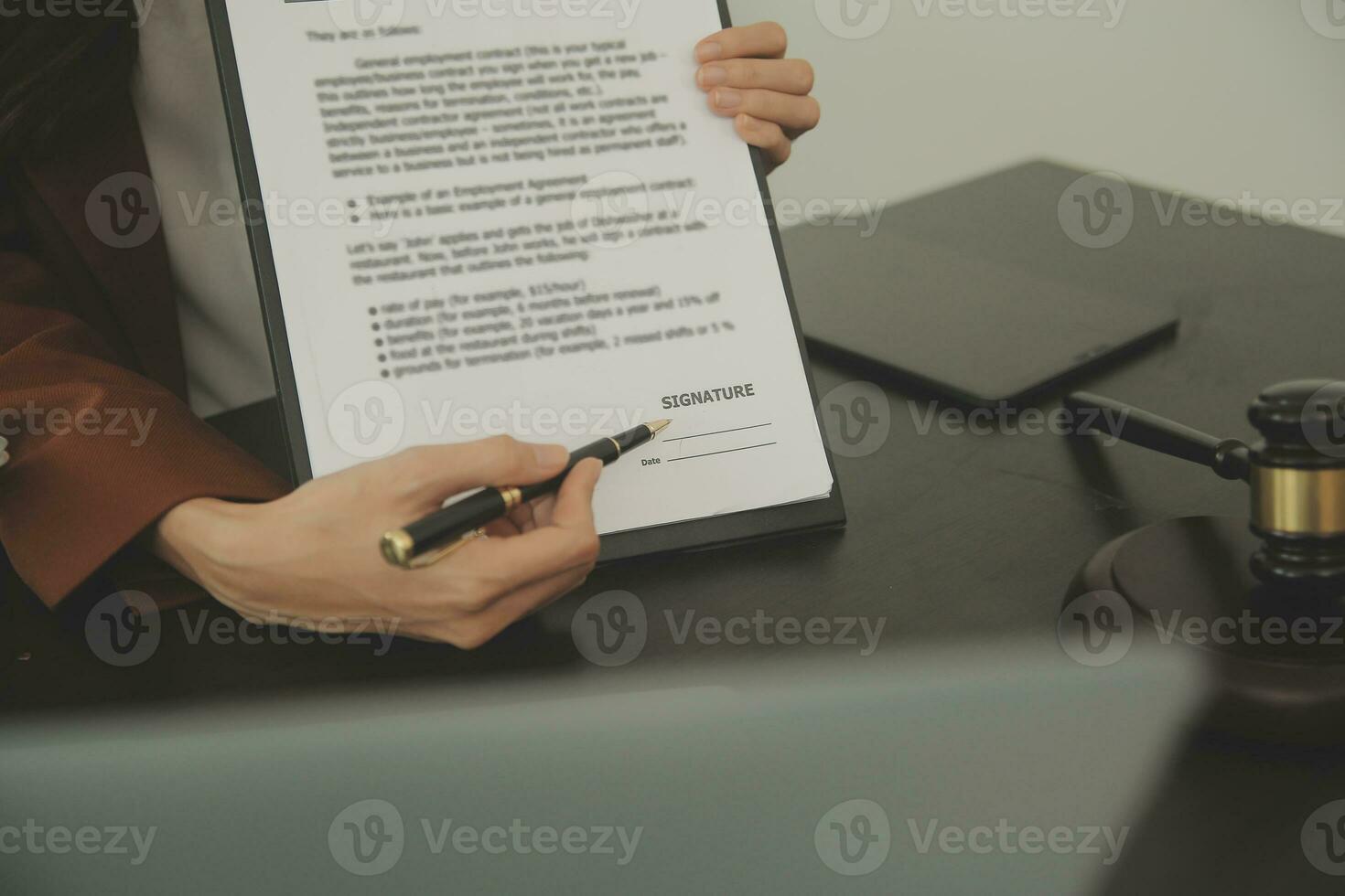 Business and lawyers discussing contract papers with brass scale on desk in office. Law, legal services, advice, justice and law concept picture with film grain effect photo